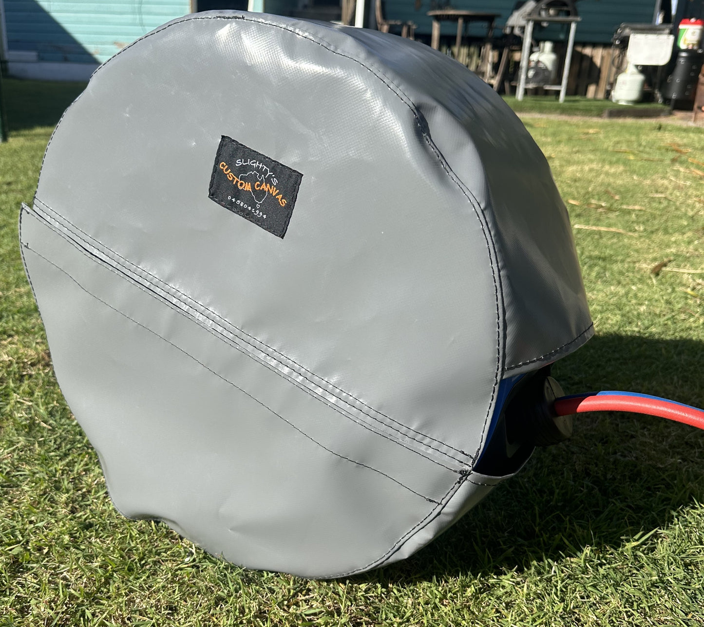 "Retracta" hose reel cover